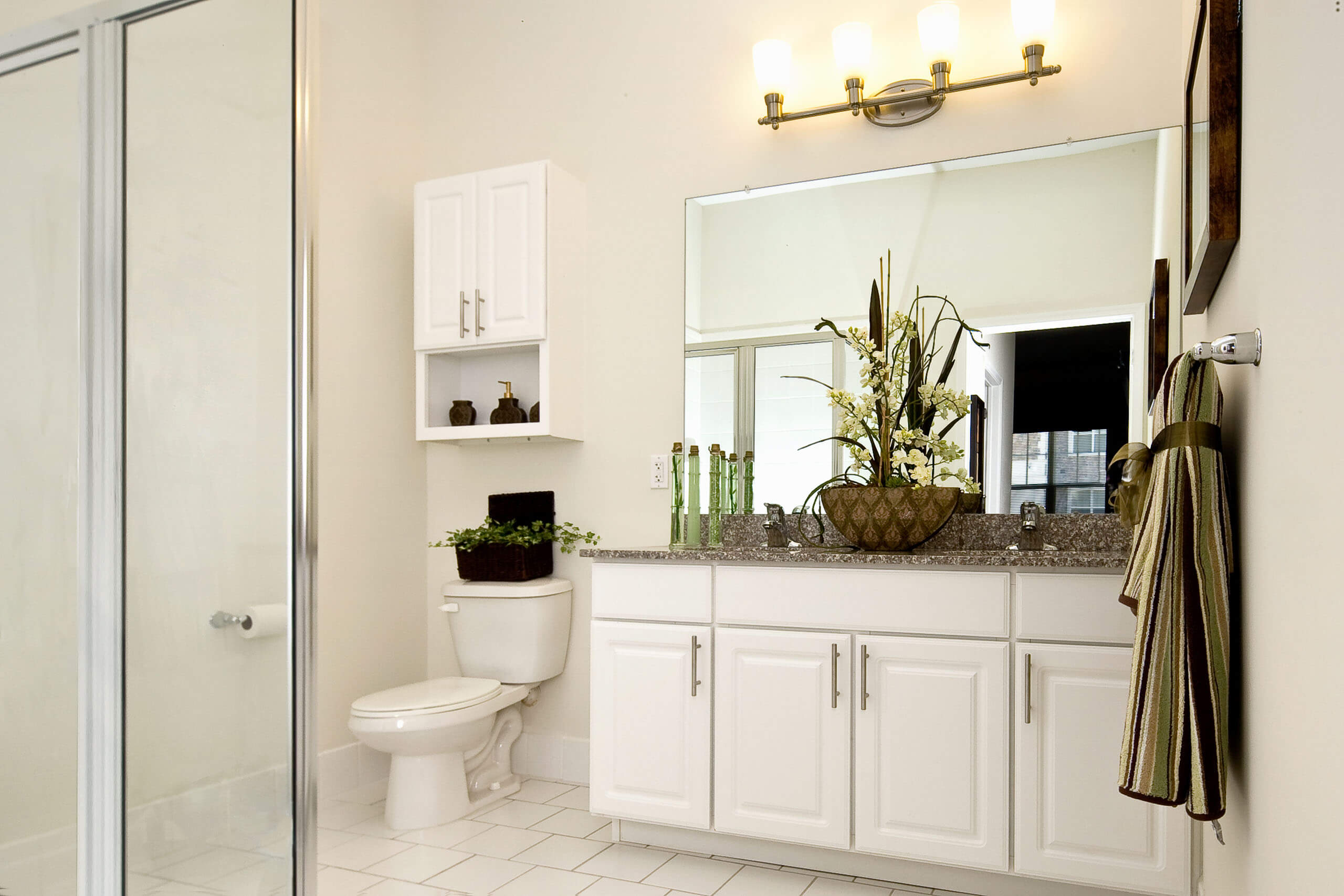 Luxury bathroom with two sinks and shower at Xchange